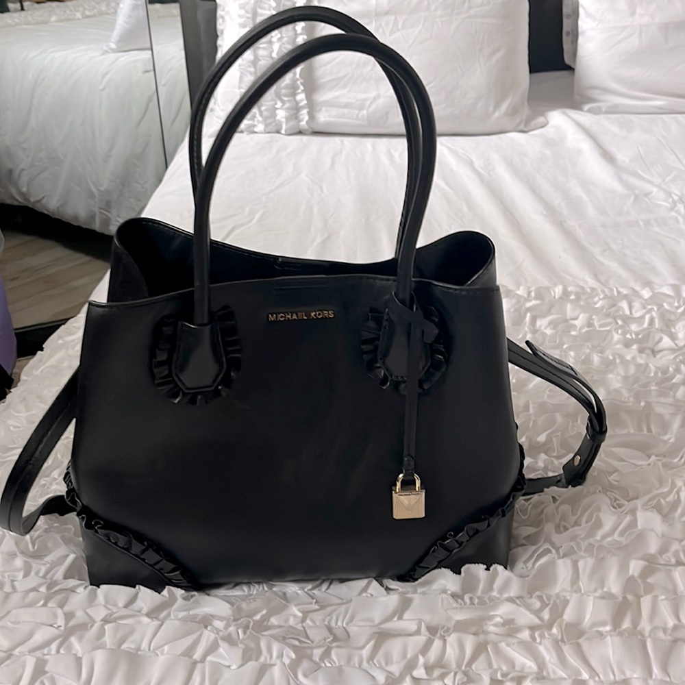 Michel Kors black handbag with cute ruffles.
